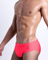 DC2 HIGH VOLTAGE RED Swim Briefs — side angle showing enhanced pouch design and minimal logo.