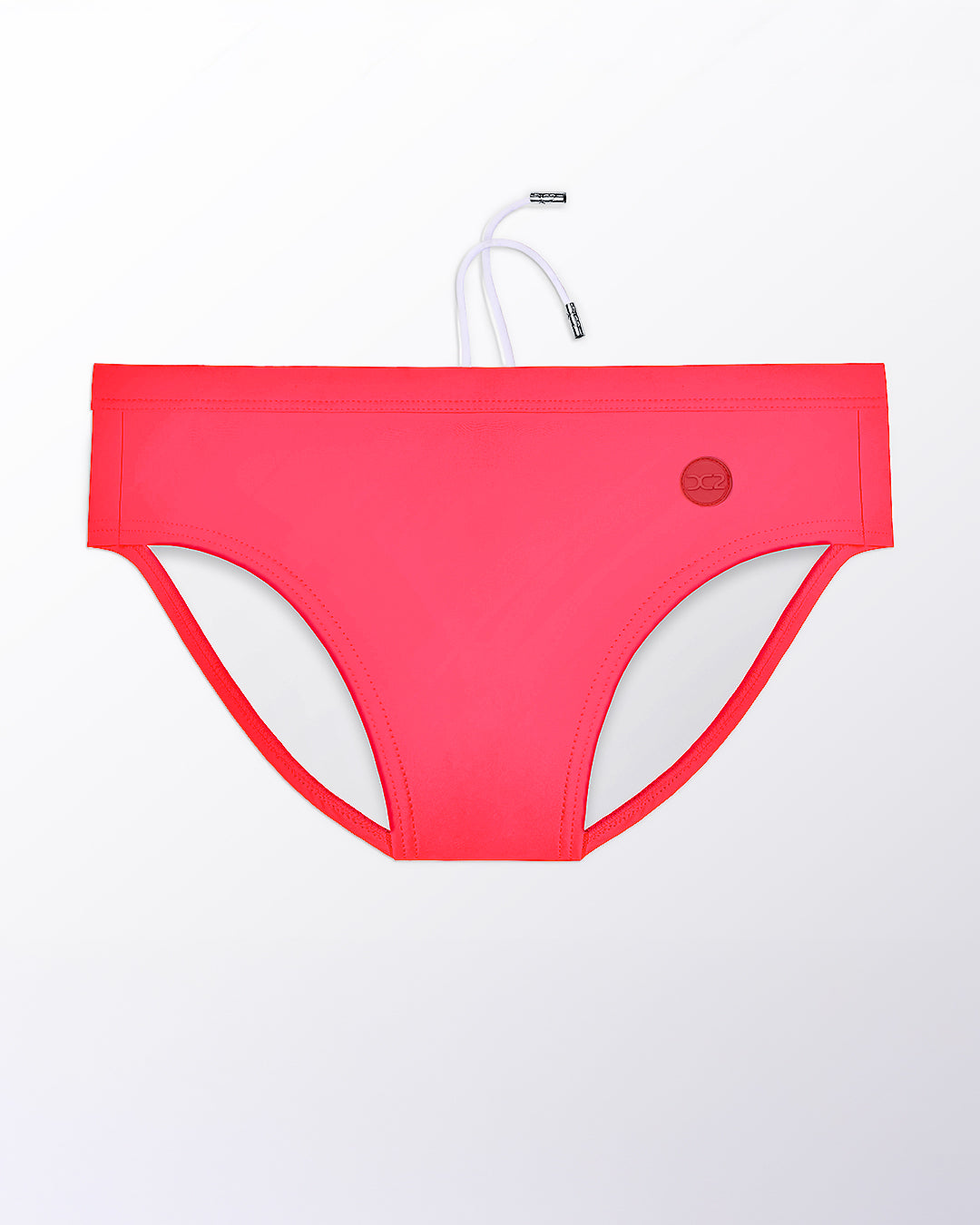 Flat lay of the DC2 High Voltage Red Swim Brief, highlighting the smooth fabric, contoured front, and minimal coverage fit.