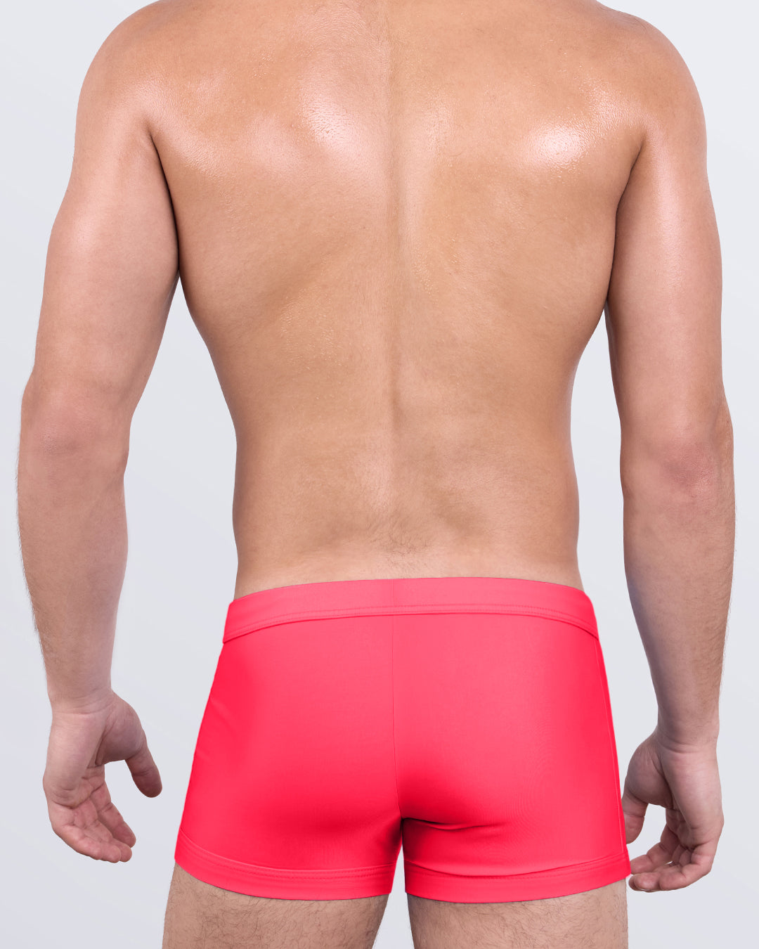 DC2 HIGH VOLTAGE RED Swim Trunks — back view showing streamlined cut and supportive fit in bright red.