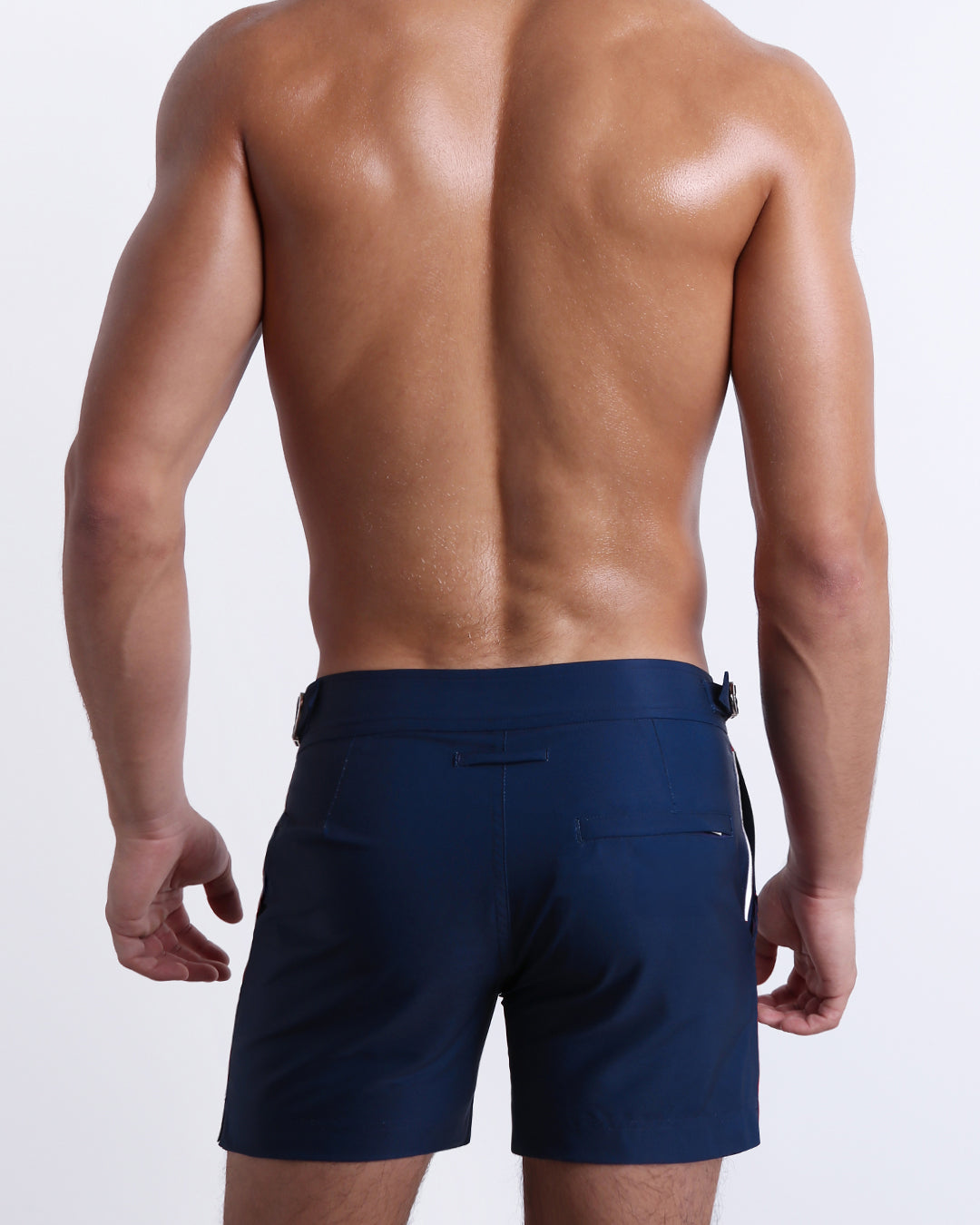 Back view of the Imperial Blue Tailored Shorts showing the streamlined silhouette, adjustable waistband tabs, and welt back pocket.