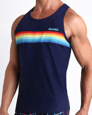 Side view of men’s casual tank top in INFINITY STRIPES in dark blue with color stripes in red, orange,yellow, blue multi colors made by Miami based Bang brand of men's beachwear.