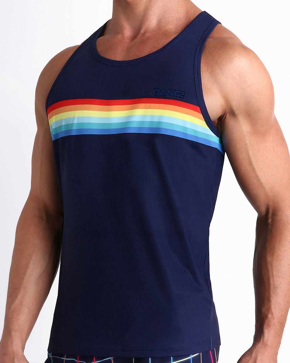 Side view of men’s casual tank top in INFINITY STRIPES in dark blue with color stripes in red, orange,yellow, blue multi colors made by Miami based Bang brand of men's beachwear.