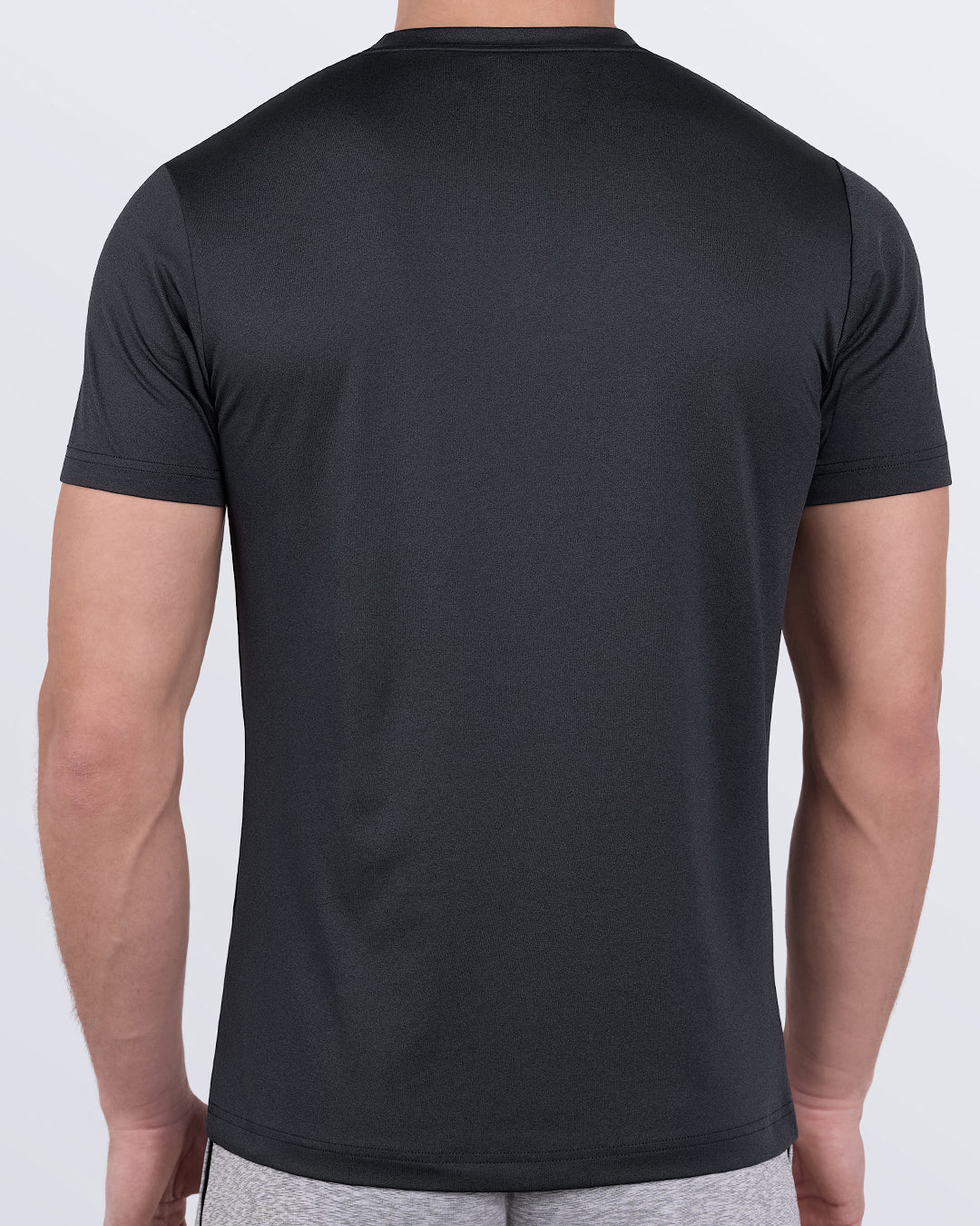 DC2 Iron Black Fitness T-Shirt — back view highlighting fitted cut and moisture-wicking finish.