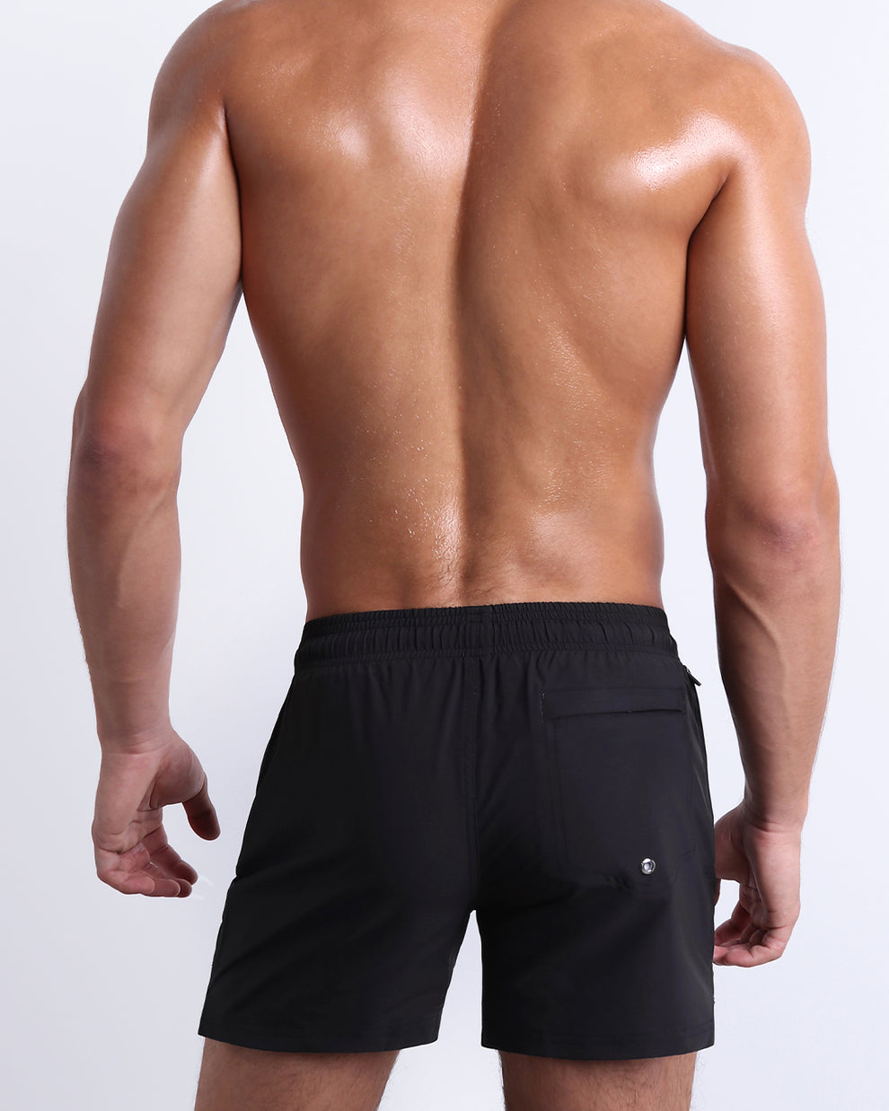 Back view of the Jet Black Resort Shorts showcasing the flap back pocket, clean fit, and comfortable elastic waistband.