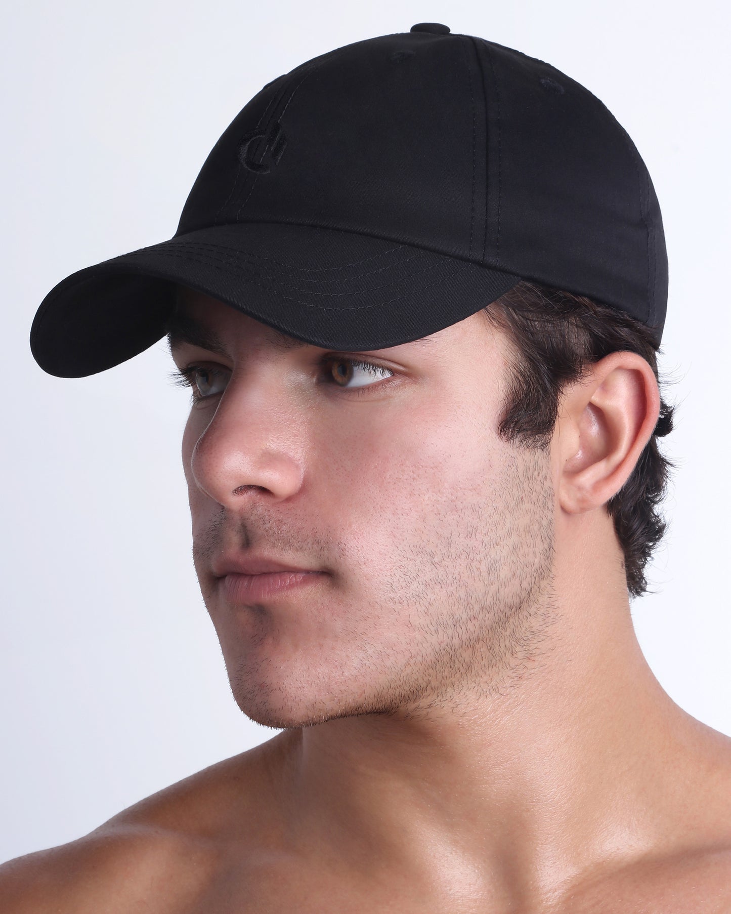 DC2 black resort cap on model, curved brim baseball cap with a clean, modern fit.