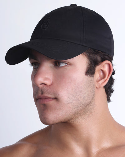 DC2 black resort cap on model, curved brim baseball cap with a clean, modern fit.