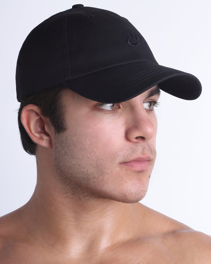 Side profile of DC2 Resort Cap in black, lightweight low-profile baseball cap designed for everyday wear.