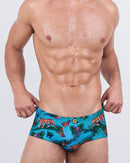 Men's swim sunga with jungle animal print – tropical blue designer swimwear featuring tigers, butterflies, palm leaves, and exotic flowers – Jungle Boogie swimsuit by DC2 Miami.