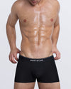 DC2 JUSTIFY MY LOVE Boxer Brief — model wearing black men’s modal boxer briefs with logo waistband and contoured fit.