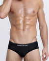 DC2 JUSTIFY MY LOVE Modal Brief — front view of men’s black underwear with bold slogan waistband and snug fit.