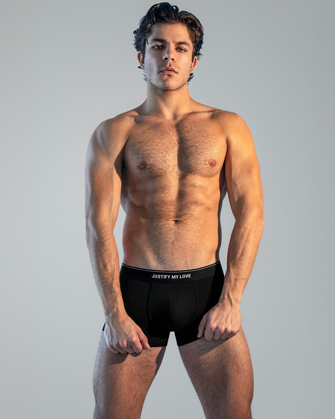 BANG! Justify My Love Boxer Brief — model wearing black modal boxer briefs featuring a sleek “JUSTIFY MY LOVE” waistband.