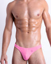 DC2 La Beach en Rose Swim Mini Brief — front view of model wearing vibrant hot pink mini swim briefs with a clean, contoured silhouette and low-rise waist.