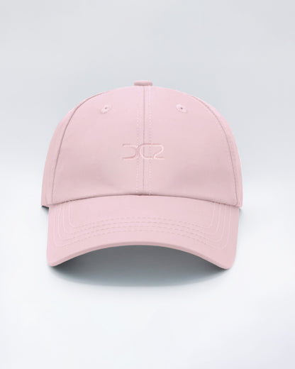 DC2 Resort Cap in Leisure Pink — front view showcasing a curved brim, structured crown, and tonal embroidered DC2 logo.