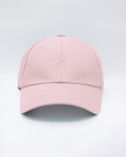 DC2 Resort Cap in Leisure Pink — front view showcasing a curved brim, structured crown, and tonal embroidered DC2 logo.