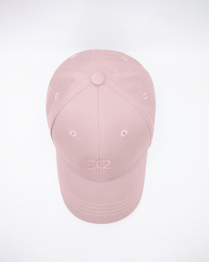 DC2 Leisure Pink Resort Cap — top view highlighting the six-panel construction, stitched seams, and breathable eyelets.