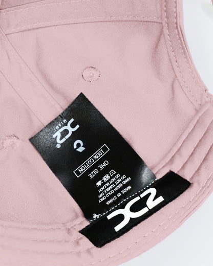 Interior view of the DC2 Leisure Pink Resort Cap — showing soft cotton lining, branded label, and adjustable construction.