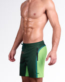 BANG Lines In Stereo Flex Boardshorts — close side view focusing on the color-block stripe detail, zip side pocket, and signature BANG logo near the hem.