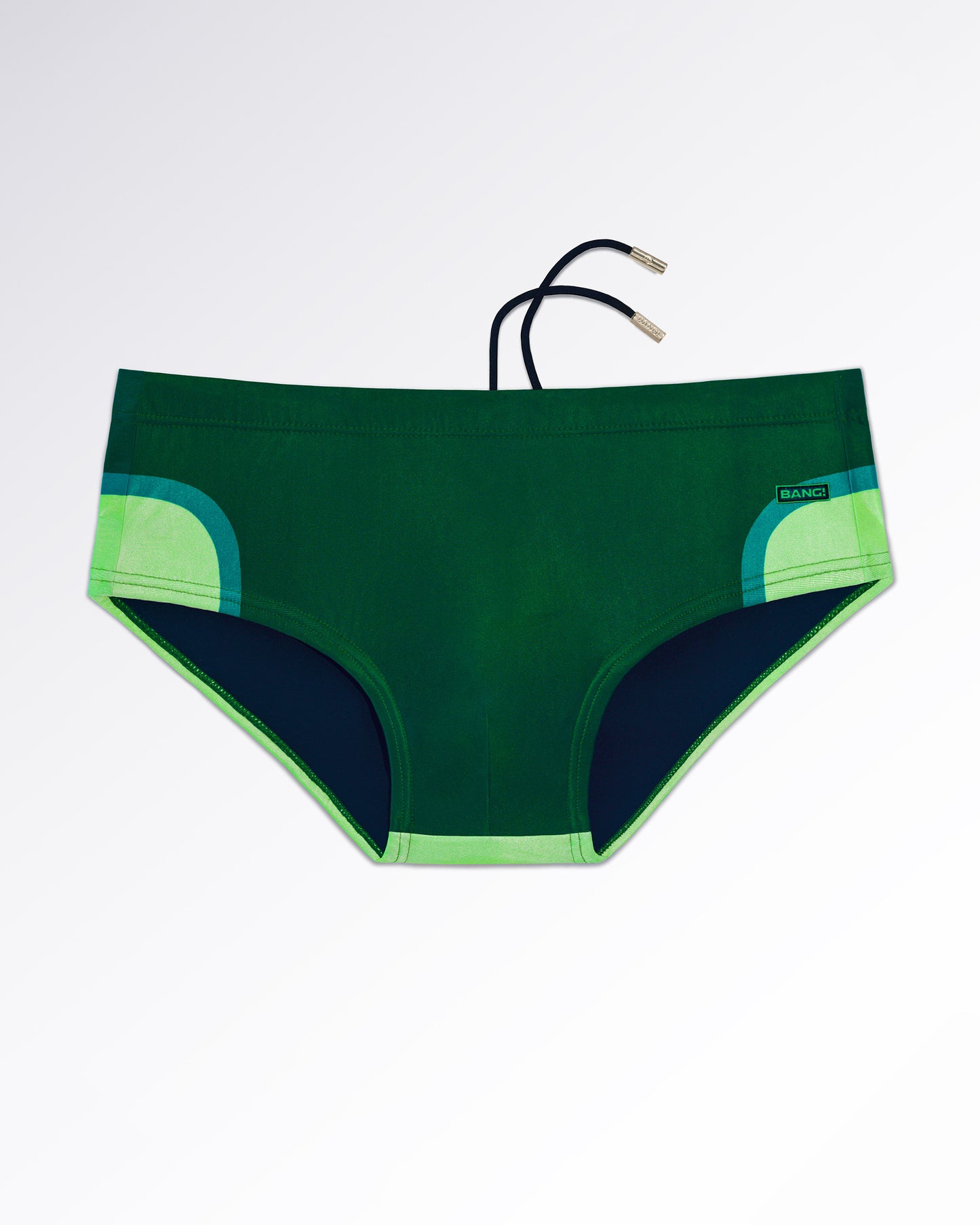BANG! Miami Lines in Stereo Swim Sunga — flat lay of dark green swim sunga with retro curved stripe detailing in lime and teal tones.