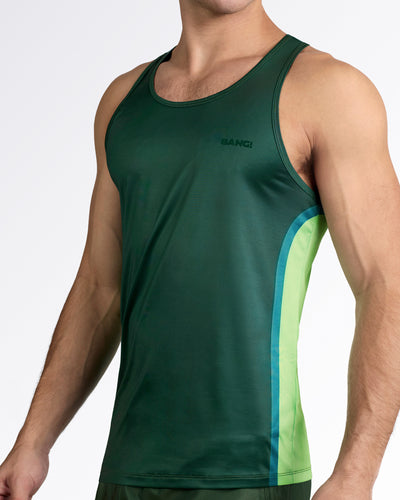 BANG Lines In Stereo Gym Tank Top — model wearing deep forest green men’s performance tank with tonal BANG logo and lime green side panel detail.