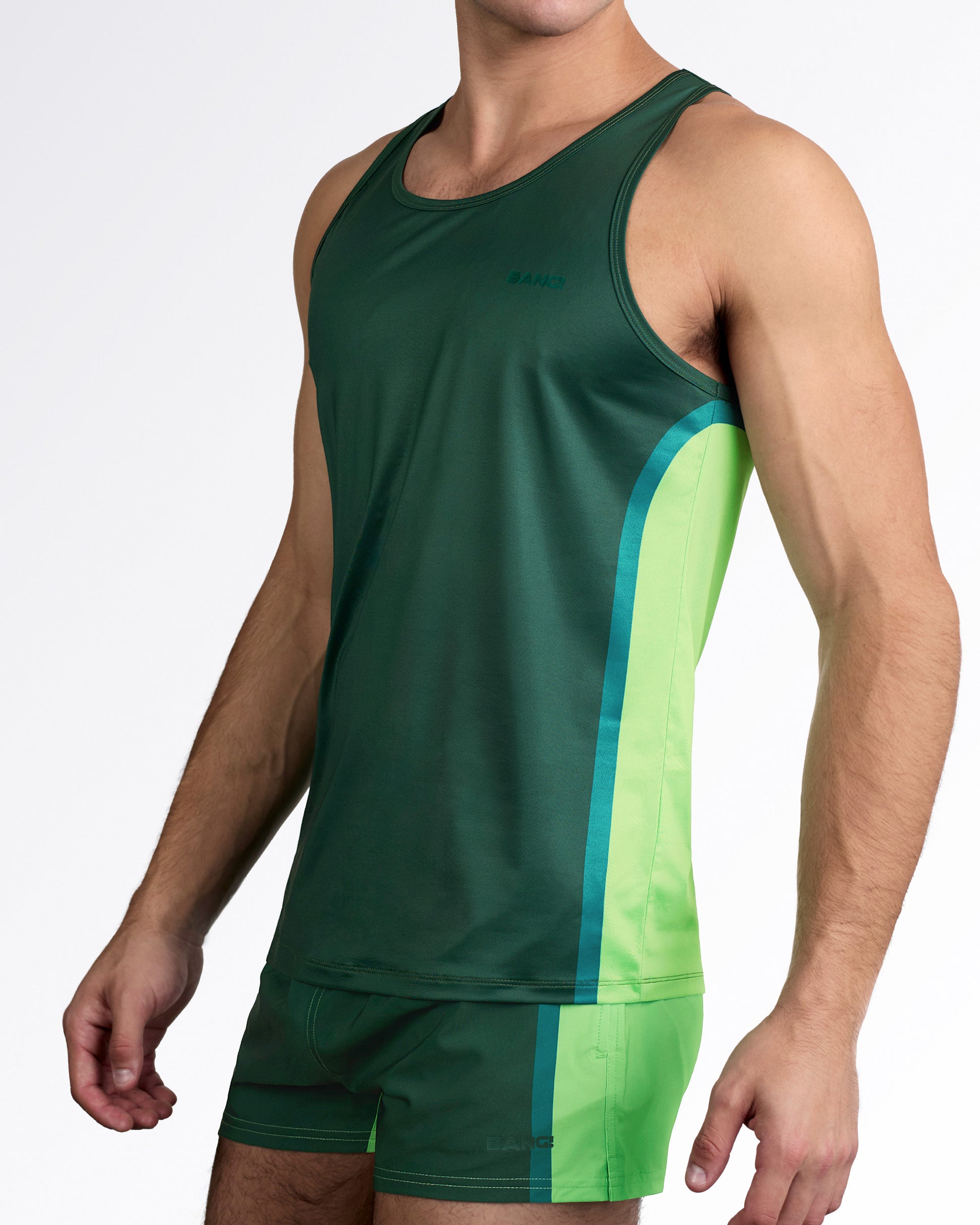 BANG Lines In Stereo Gym Tank Top — angled full body view styled with matching green performance shorts for a coordinated activewear set.