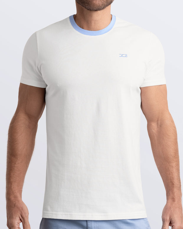 Frontal view of a male model wearing a solid white Pima cotton t-shirt with a light blue collar, crafted for stylish casual wear and beachwear by DC2 Miami. Premium quality men&