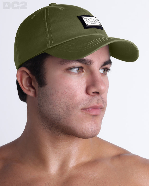 Side view of the Chillax Cap in MAGNUM GREEN,  a dark green color, features ventilation eyelets on the cap to provide extra breathability, perfect for active wear.