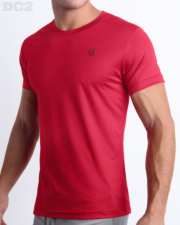 Side view of men’s performance exercise top in a bright solid red color made by DC2 the official brand of mens sportswear.