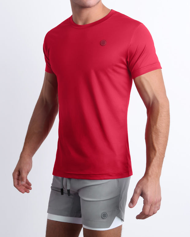 Side view of a male model wearing the MAJESTIC RED Fitness T-Shirt with the SPACE GRAY Endurance Shorts Lines for men by DC2 a BANG! Miami Clothes capsule brand.