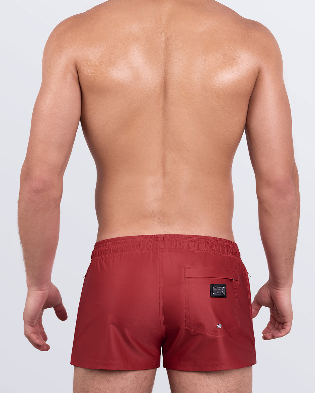 Back view of Majestic Red Poolside Shorts with zip pocket and DC2 Miami logo patch for sleek functionality.