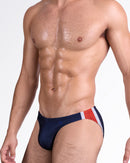 DC2 Maritime Swim Mini Brief — angled side view highlighting contrast red, white and navy color blocking.