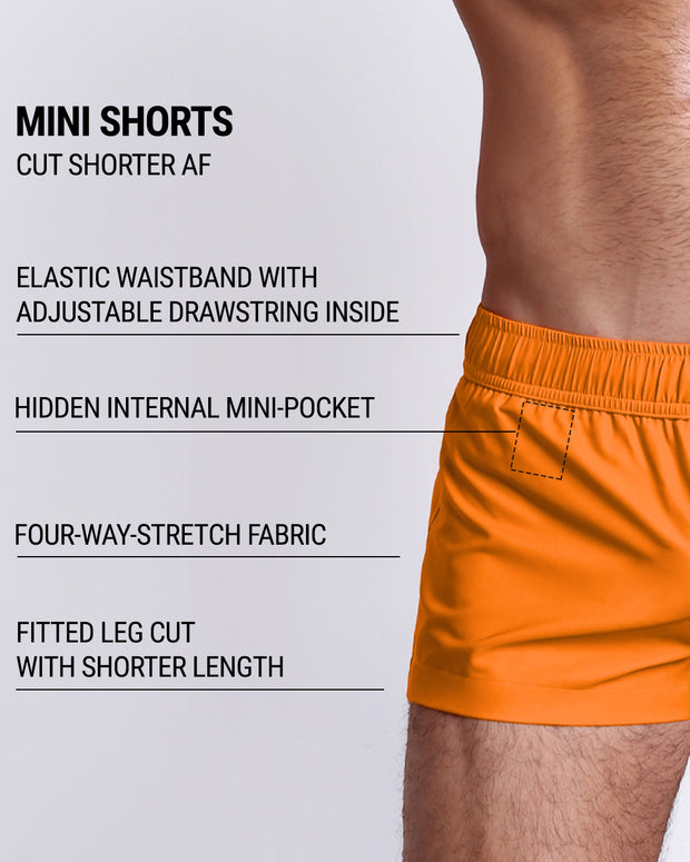 Infographic explaining the many features of the MATCH POINT ORANGE Mini Shorts. These MINI SHORTS have elastic waistband with adjustable drawstring inside, hidden internal mini-pocket, 4-way stretch fabric, and are quad friendly with fitted leg cut with shorter leg length. 