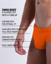 Infographic explaining the classic cut with a tune-up MATCH POINT ORANGE Swim Brief by DC2. These men swimsuit is low-rise seat for optimal fit, available with or without 'Full-Pack' insert, comfier front pouch, and fully lined inside.