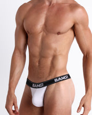 Side view of model wearing the MAX WHITE soft cotton underwear a white buttery-soft elastic waitband with the BANG! Logo for men by BANG! Miami the official brand of men's underwear.