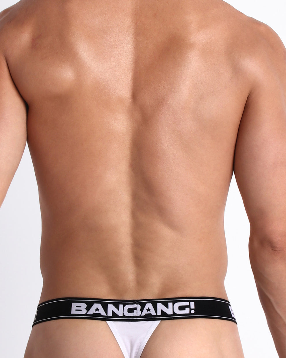 Back view of model wearing the MAX WHITE from the Retro line Men’s breathable cotton thongs for men by BANG! Ideal choice when you want to avoid visible underwear lines.