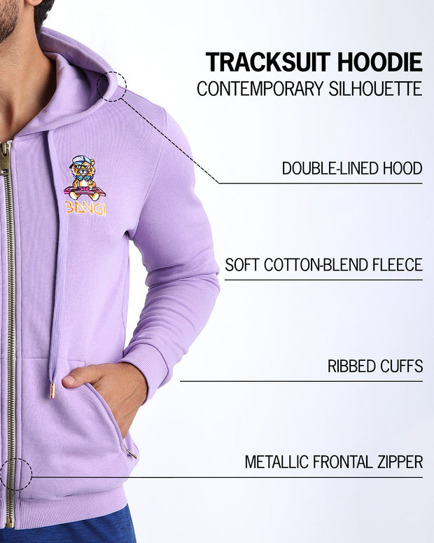 An infographic explaining the features of BANG! Clothes’ Tracksuit Hoodie, including a contemporary silhouette, double-lined hood, soft cotton-blend fleece, ribbed cuffs, and a metallic frontal zipper.