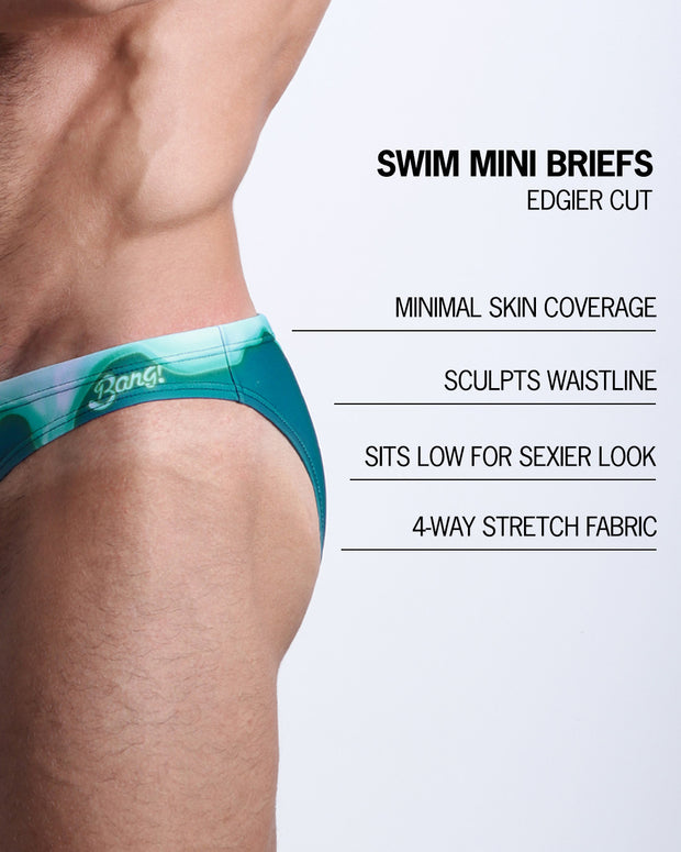 Infographic explaining the features of the MINT CONDITION Swim Mini Brief made by BANG! Clothes. These edgier cut mens swimsuit are minimal skin coverage, sculpts waistline, sits low for sexier look, and 4-way stretch fabric.