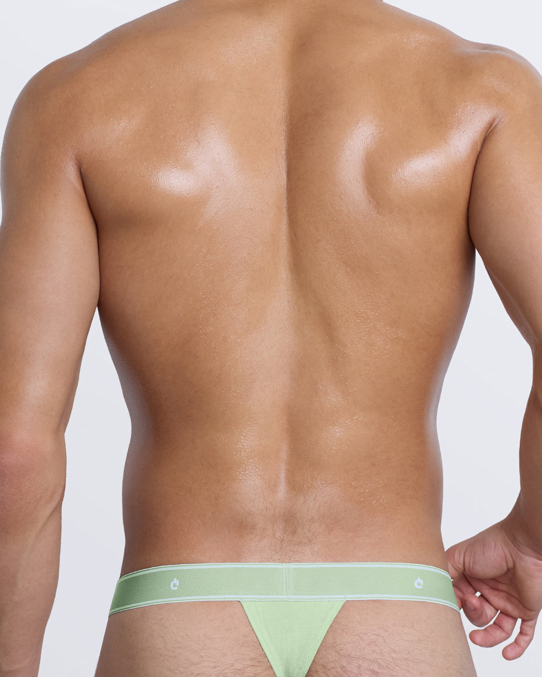 DC2 Modal Thong — back view in mint green with sleek thong fit and tonal elastic waistband featuring DC2 logo.