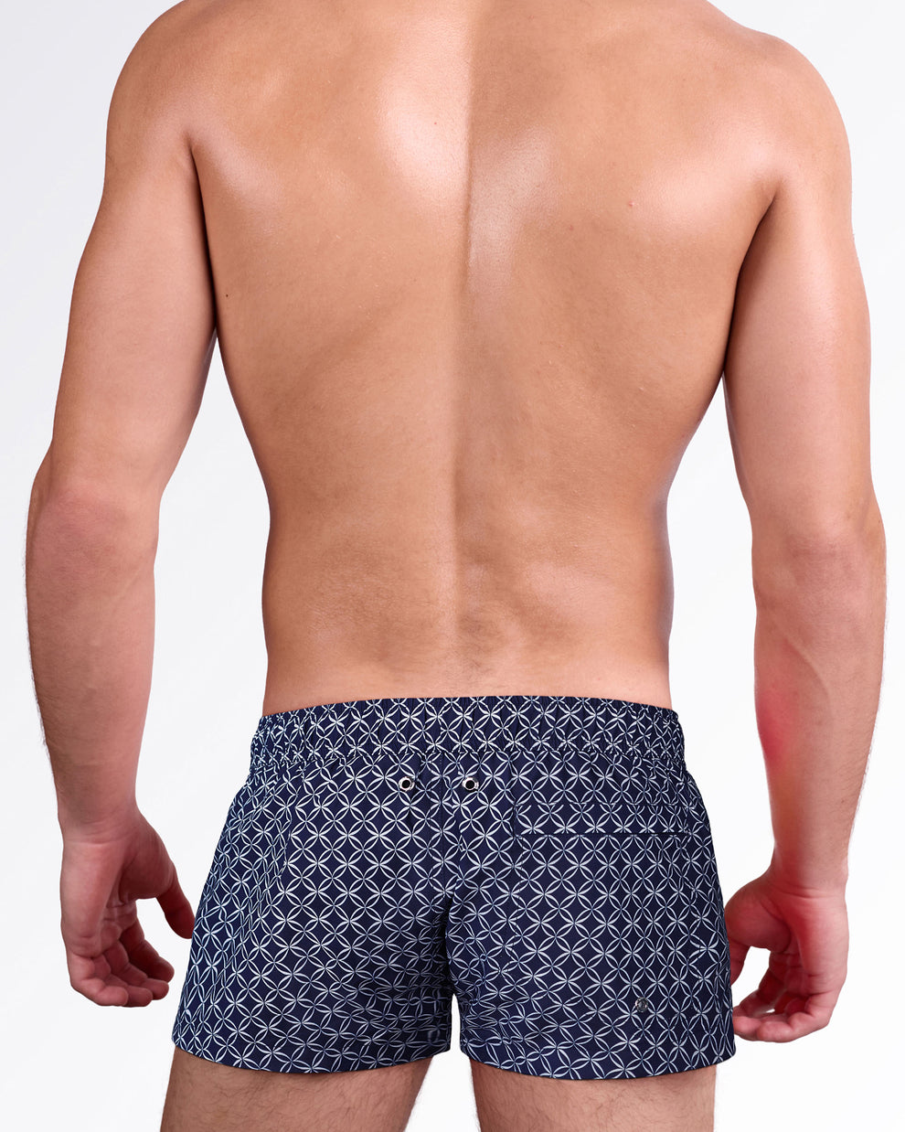 Back view of Mono Waves Blue Mini Shorts by DC2 Miami showcasing the signature geometric pattern, rear pocket and mini short silhouette.