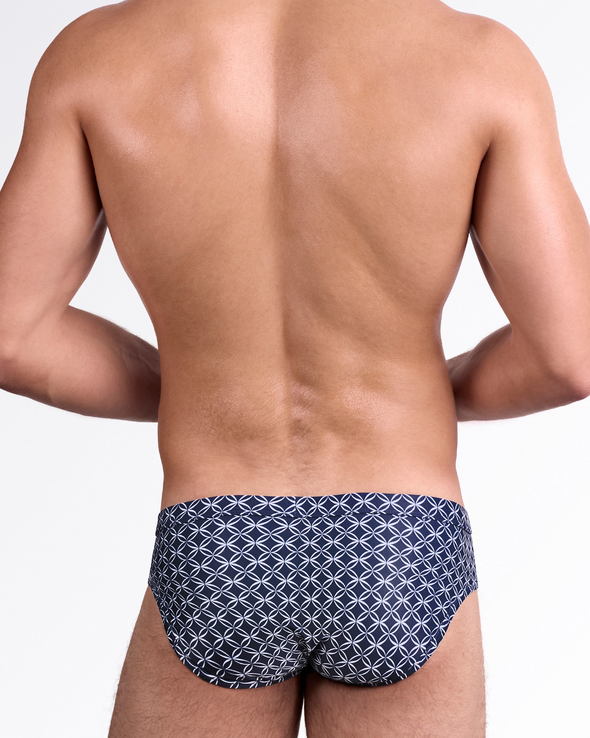 DC2 Mono Waves (Blue) Swim Brief — back view showcasing allover circular wave motif in white on deep blue background with contoured rear cut.