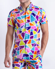 Male model wearing MOSAIC men’s sleeveless stretch shirt and matching swimwear shorts, with a retro abstract colorful mosaic pattern for men. This premium quality top is by BANG! Clothes, a men’s beachwear brand from Miami.