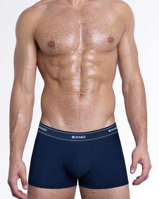 Model wearing BANG! Skin Soft Boxer Briefs in Navy Blue, featuring a rich navy finish, supportive contour pouch, and an ultra-soft, second-skin feel.