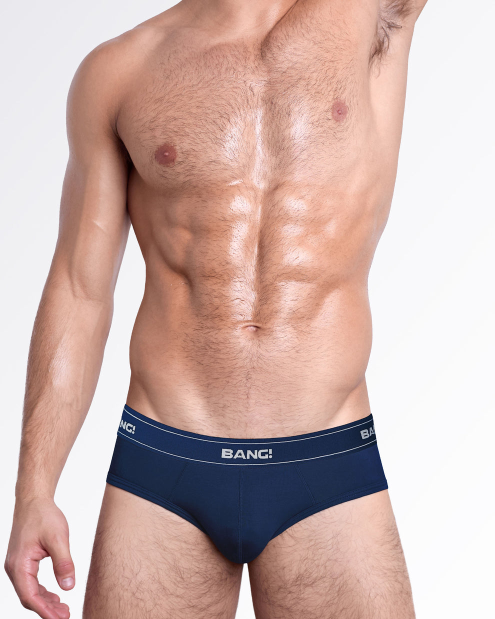 Model wearing BANG! Miami Skin Soft Modal Cotton Briefs in navy blue with a soft modal blend, supportive fit, and signature logo waistband.