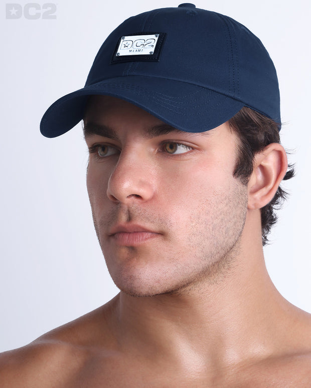 Side view of the Chillax Cap in NAVY BLUE,  a dark blue color, features ventilation eyelets on the cap to provide extra breathability, perfect for active wear.