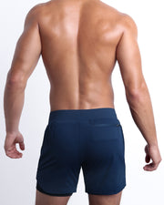 Back view of the NAVY men's fitness compression lined workout shorts in a dark blue color. These premium quality quick-dry endurance shorts are DC2 by BANG! Clothes, a men’s beachwear brand from Miami.