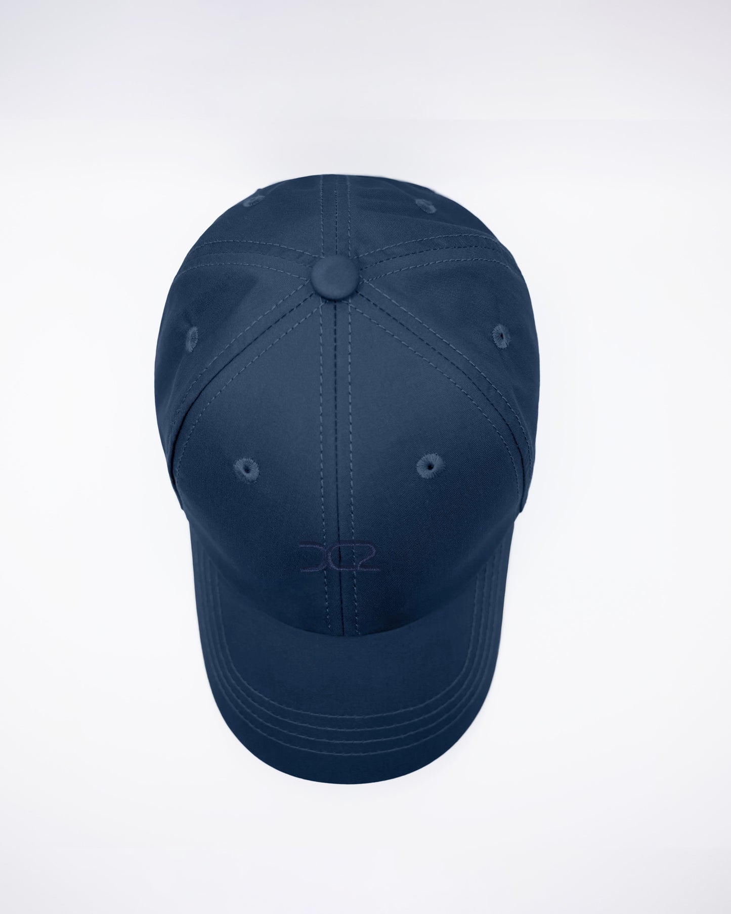 DC2 Navy Blue Resort Cap — top view highlighting the six-panel construction, stitched seams, and breathable eyelets.