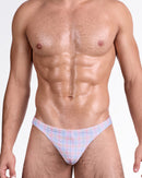 DC2 Ocean Drive Check Swim Thong — model wearing pastel plaid swim thong featuring soft pink and blue check pattern with sleek low-rise silhouette.
