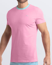 Side view of a men's premium solid pink Pima cotton t-shirt with a aqua collar and embroidered DC2 logo. Perfect for a modern casual look, this streetwear tee is part of the DC2 Miami men's beachwear collection, designed for comfort and style.