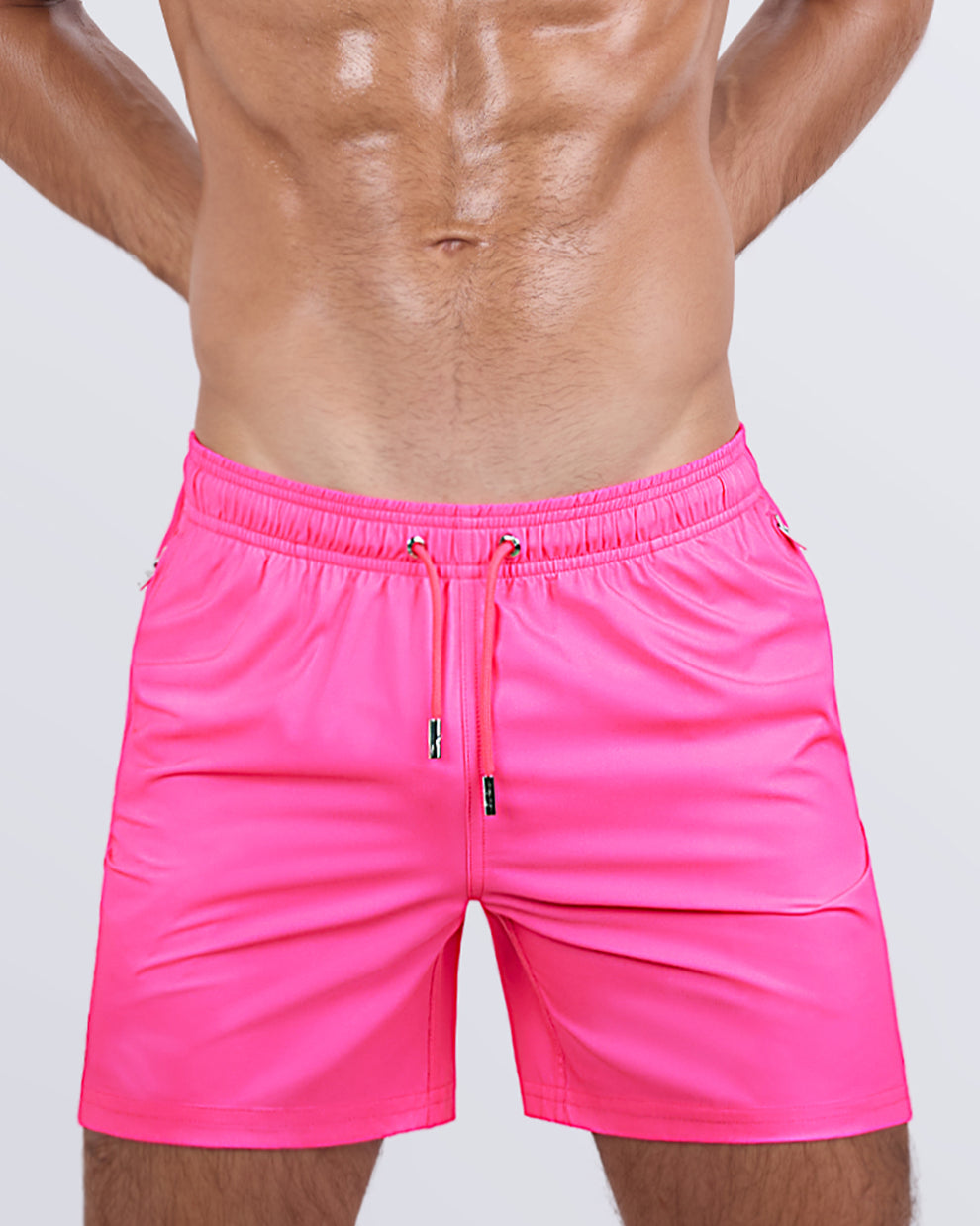 View of the PINK BOMB for men’s summer Resort Shorts with dual zippered pockets in a solid pink color designed by DC2 a brand based in Miami.