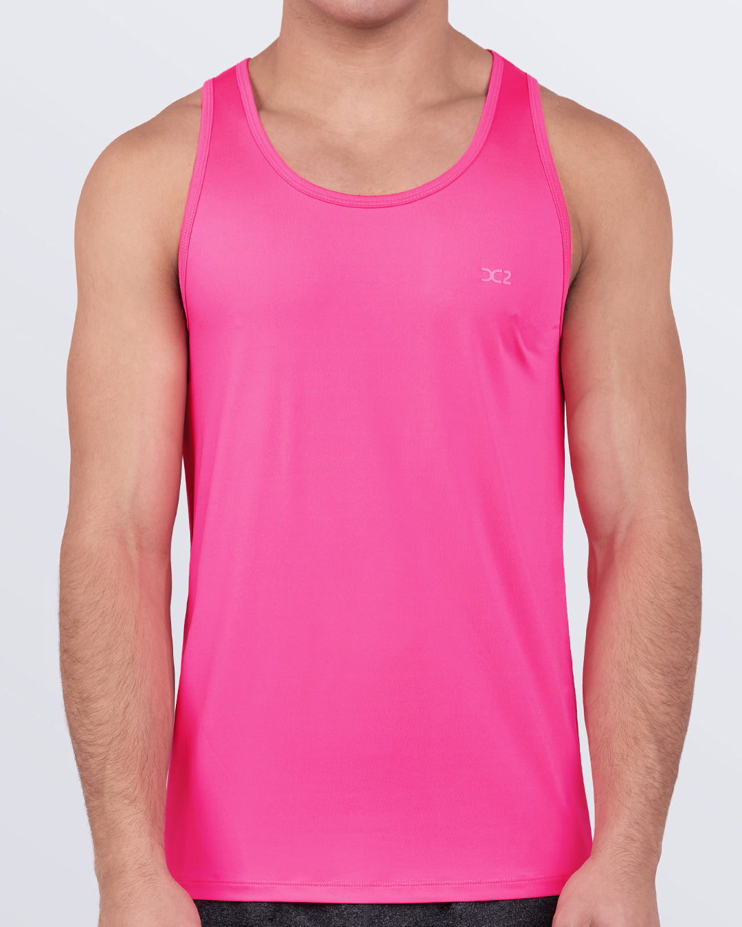 DC2 Pink Bomb Gym Tank Top — front view of men's athletic tank in vibrant hot pink color.