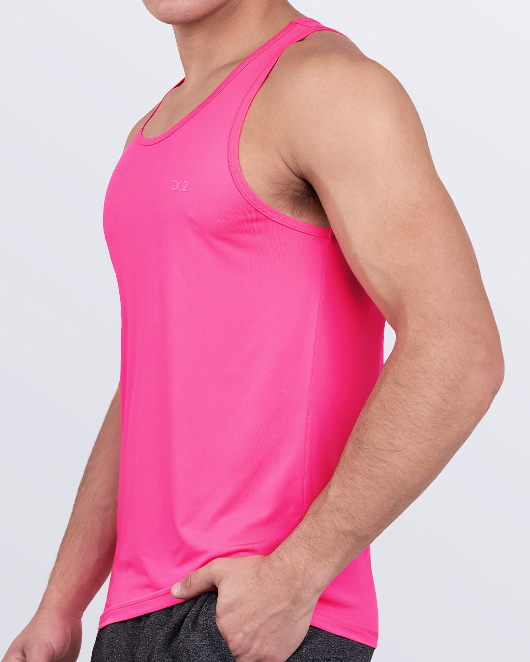 DC2 Pink Bomb Gym Tank Top — side view highlighting sleeveless cut and lightweight stretch fabric.